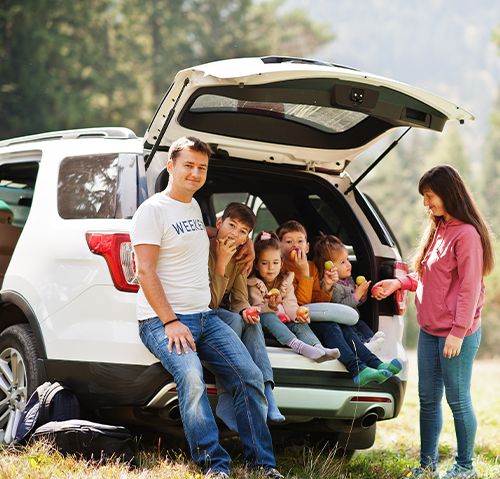 family in rear of SUV