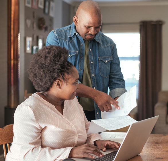 Image of couple reviewing their MidWestOne checking account statement